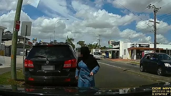 A woman emerges from the SUV. Picture: Facebook/Dashcam Owners Australia