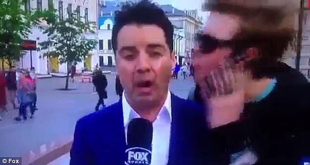 Fox Sports reporter Daniel Garb was part-way through a live-cross from Kazan, Russia's Republic of Tatarstan, when a young man approached and tried to plant a kiss on his cheek