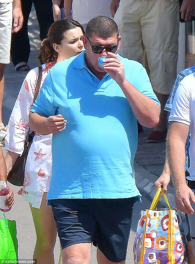 Moving on: James, who resigned as a director of Crown Resorts in March citing mental health problems, looked in happy spirits as he relaxed on the French Riviera on Thursday
