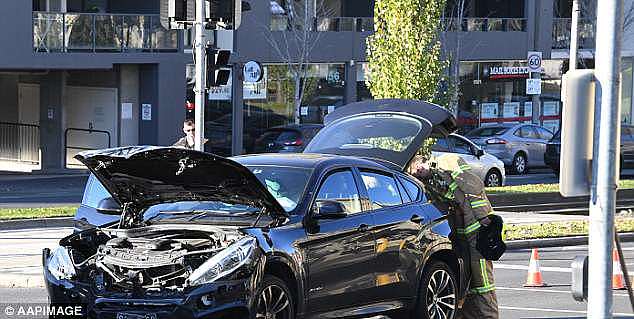 The ambulance collided with a BMW on the corner of Queensbury and Peel streets at about 9am