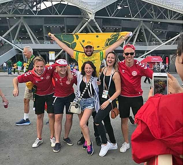 Mr Lecher and other family pose with Danish fans outside the stadium in Samara