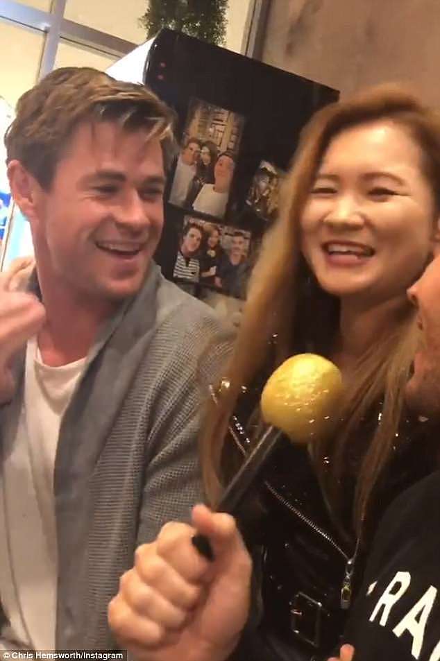 Someone give the guy a hand! Chris Hemsworth was left red-faced as he failed to high-five an adoring female fan in spectacularly awkward exchange on Saturday