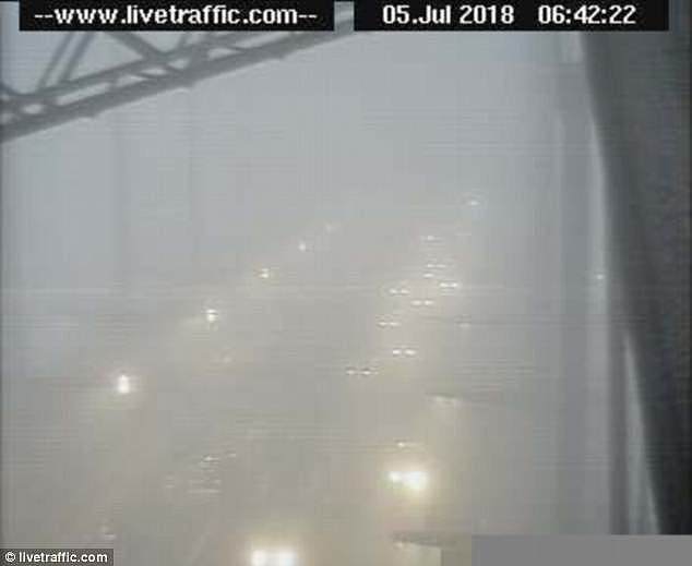 Concentrated around the central business district and Sydney Airport, the fog led to delays on all incoming flights (pictured is the fog on the Harbour Bridge)