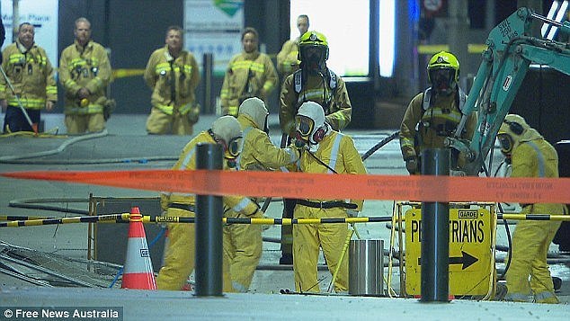 Emergency crews (pictured) worked through the night to fix the dangerous leak after road workers struck a high pressure gas pipe shortly after 10.30pm in the CBD