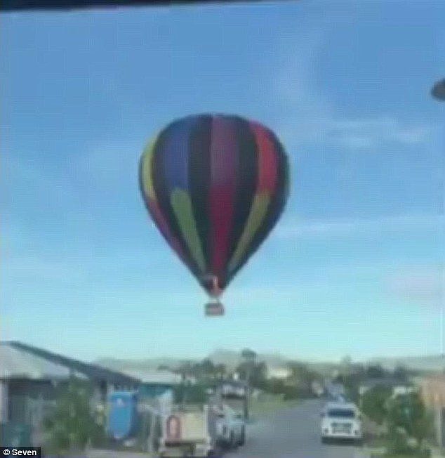Footage showed the colourful balloon slowly approaching a housing estate before it hit the ground