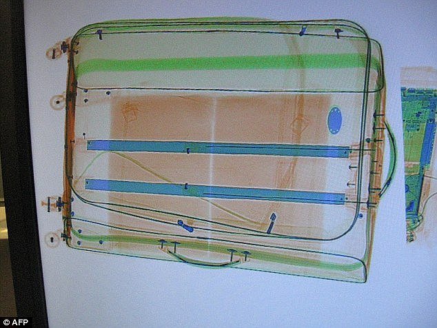 An X-ray of the man's suitcase revealed two packages of white powder concealed underneath the lining, police said