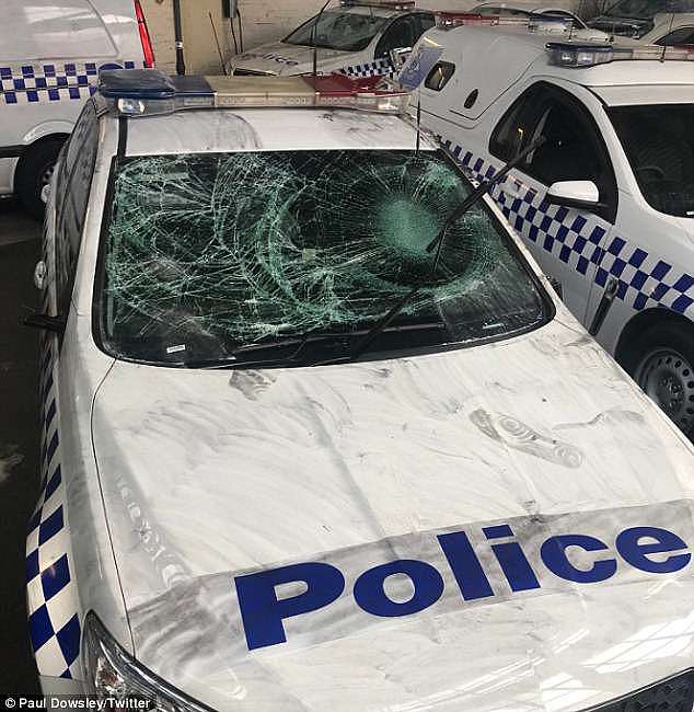 The South Sudanese leader more recently said his community did not have a 'youth gang problem' and instead accused the media of unfair reporting. (Pictured: A police car damaged when police arrived at a party at a Melbourne home where four police vehicles were trashed)