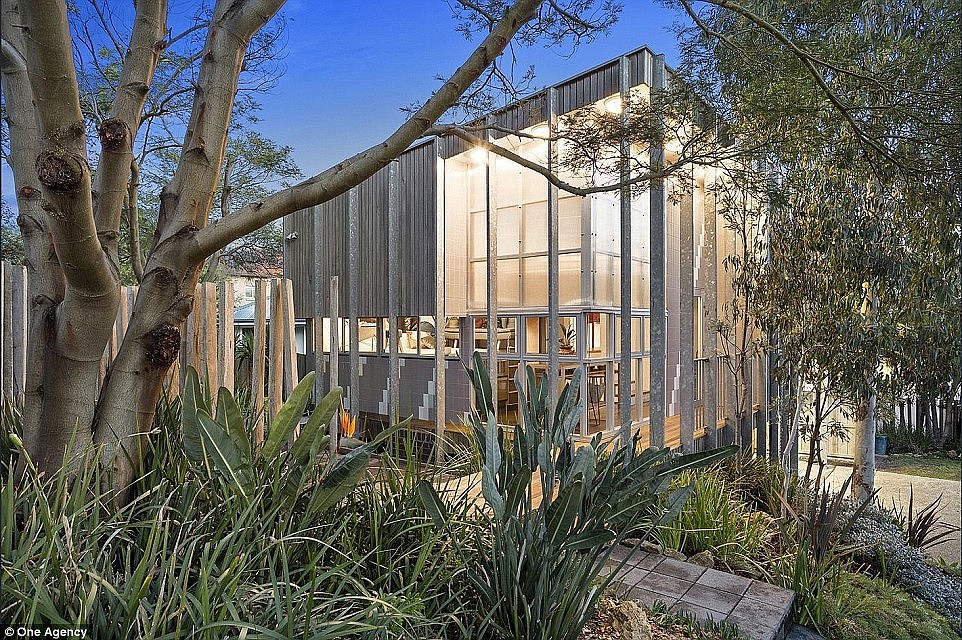 The stunning two-story tiny home, located in Torquay, Victoria, (pictured) has a facade of steel and timber cladding