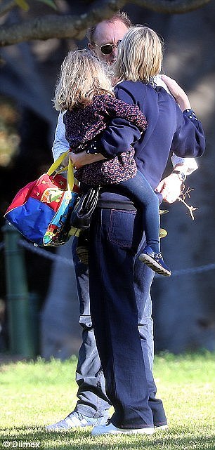 Pucker up! Cate Blanchett and Andrew Upton put on a rare PDA during a family day out in Sydney on Thursday