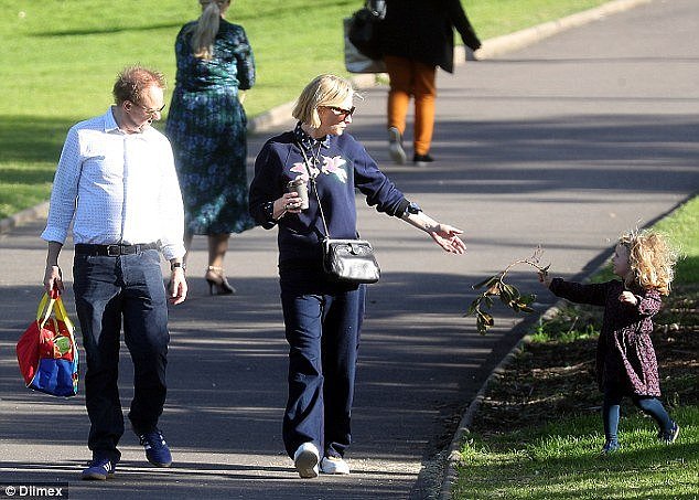 A present for mummy? The couple's four-year-old daughter Edith handed Cate a branch