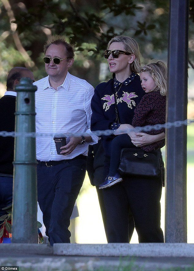 A helping hand: Andrew carried Cate's coffee cup so she could hold onto little Edith