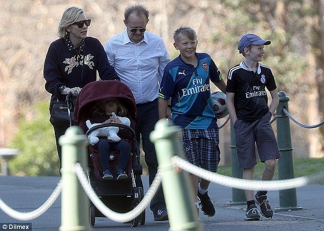 Game: The happy family strolled around the streets of Sydney together, before heading to a park so the boys could enjoy a game of soccer