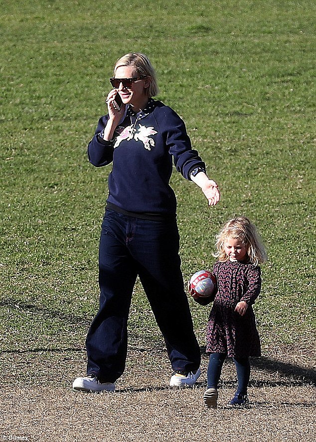 Multitasking! Cate was engaged in a phone conversation while she played with Edith 