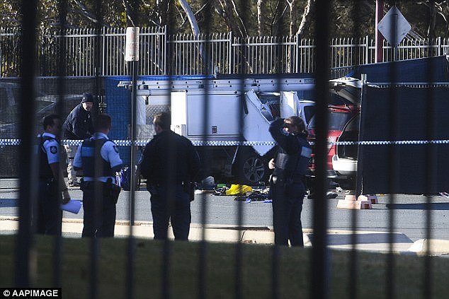 The school sent out an email following the incident informing the community a parent had passed away (detectives and police pictured at the scene)