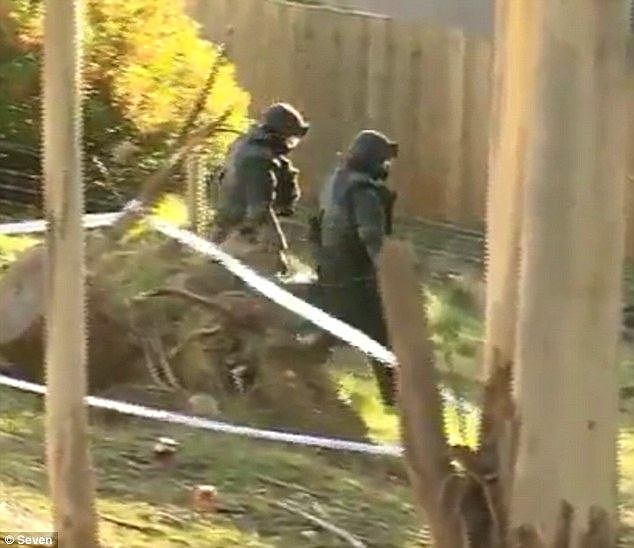 Police seized the dangerous ingredients from a South Hobart address in Tasmania Friday night, with officers seen at the property wearing full-body protective gear (pictured)