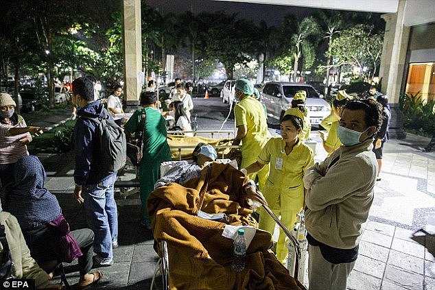 Hospital patients are moved outside of the hospital building after an earthquake was felt in Denpasar, Bali 
