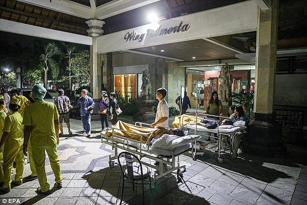 Hospital patients are moved outside of the hospital building after an earthquake was felt in Denpasar, Bali