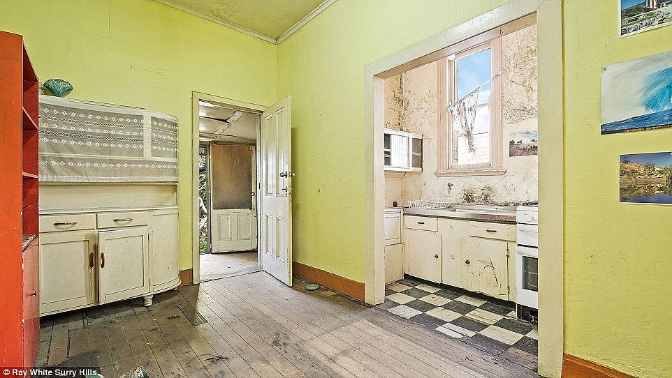 While two properties in nearby Erskineville, both expected to sell  for around $1,000,000, show dented walls, peeling walls and barren gardensÂ (Pictured: 48 Charles Street)