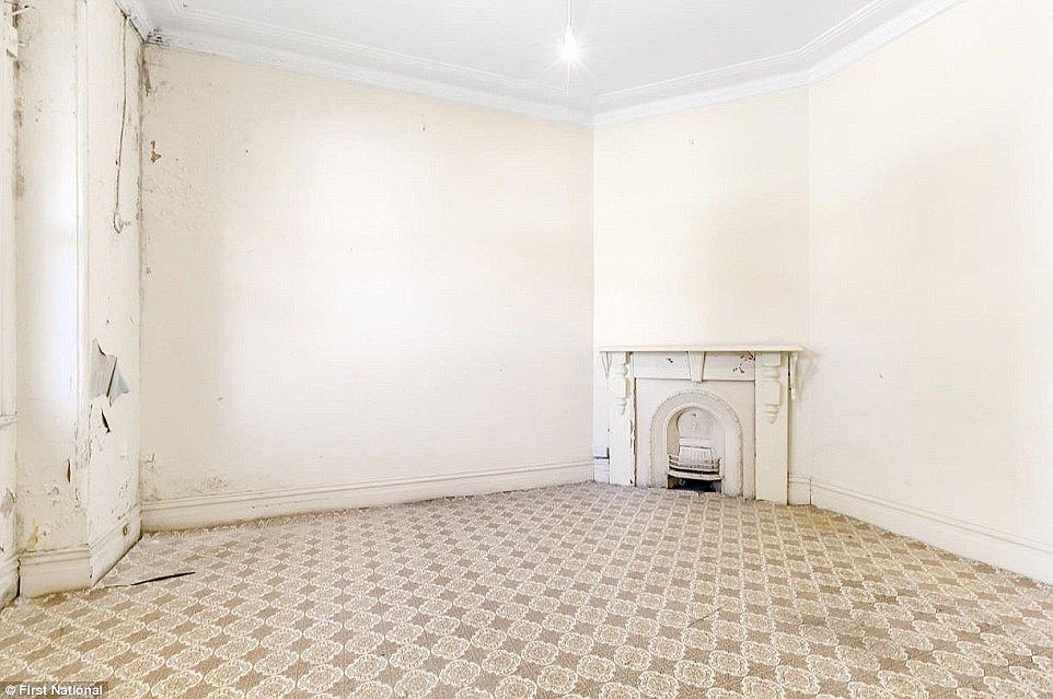 Another Marrickville property, this time on Calvert Street, shows broken floor boards, cracked fireplace and decaying wallsÂ (Pictured: 37 Calvert Street)