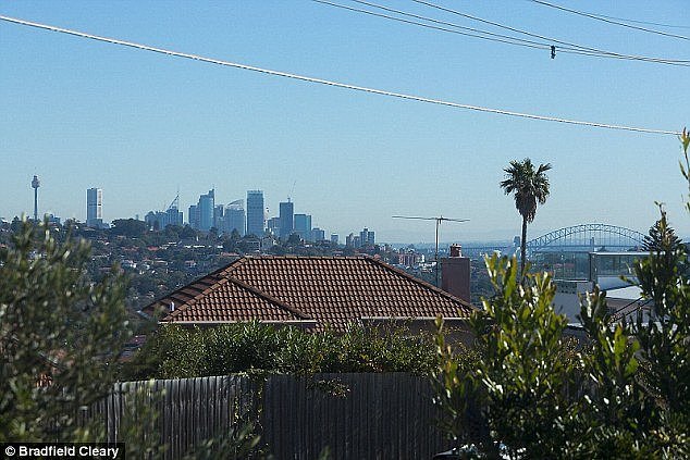 Stunning view:Â 'This charming home offers rare dual perspectives with expansive views across the city skyline and Harbour Bridge,'Â agent Bradfield Cleary wrote online