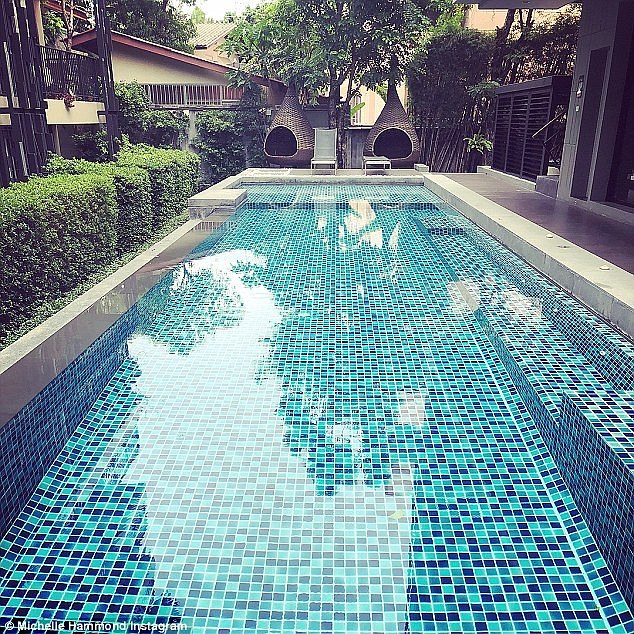 'Compare this to our modern condo in the trendy Chiang Mai suburb of Nimman, which comes with a pool, gym, sauna, library, rooftop area and more,' Ms Hammond said (pictured is their new pool)