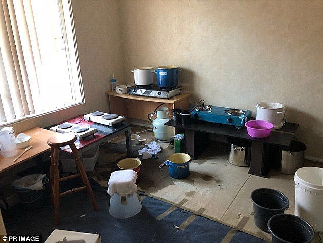 This image shows the inside of a house where the dangerous drug was manufactured before 150 litres of liquid methamphetamine was discovered