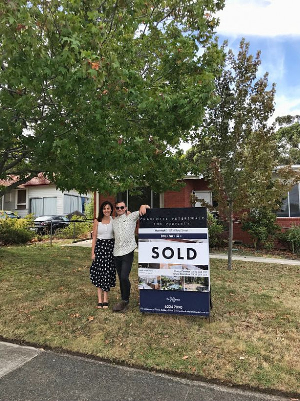 Thomas_and_Whitney_outside_their_first_home_ahzkln.jpg,0