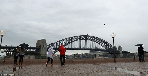 35B668E900000578-3661738-Surveying_the_Sydney_Harbour_Bridge_in_warm_winter_jackets_and_h-a-24_1467019508853.jpg,0