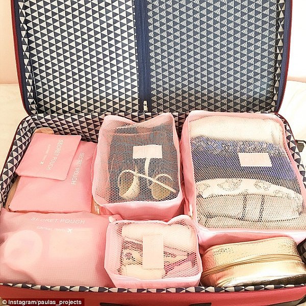 50621F5A00000578-6183321-Packing_cubes_have_become_the_holy_grail_of_suitcase_perfection_-a-23_1537331219778.jpg,0