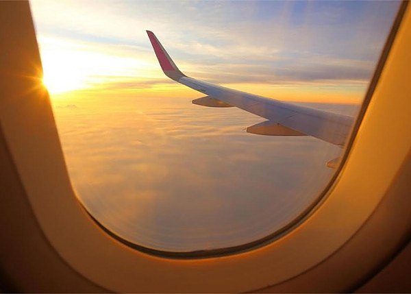 f2ad5f41-b1fd-42dd-8220-aa0376d3875a-plane-window-sunset.jpg,0