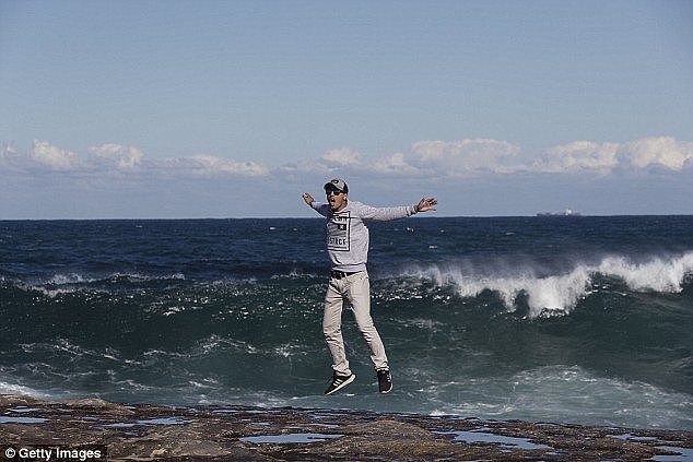 Nailed it! Massive waves provided the best backdrop for snap-happy risk takers around Sydney