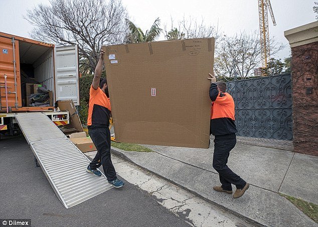 Boxes of varying sizes were moved out of a removal truck and into the Turnbull's mansion after Mr Turnbull resigned from federal parliamentÂ 