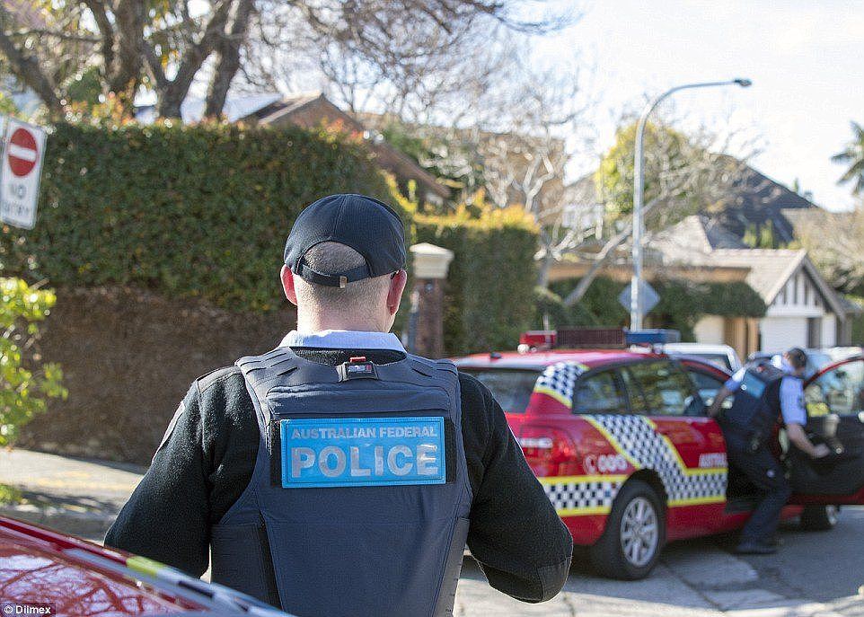 Pictures showed AFP officers guarding the front entrance to his lavish home, while others sifted through the gardens at the rear of the property