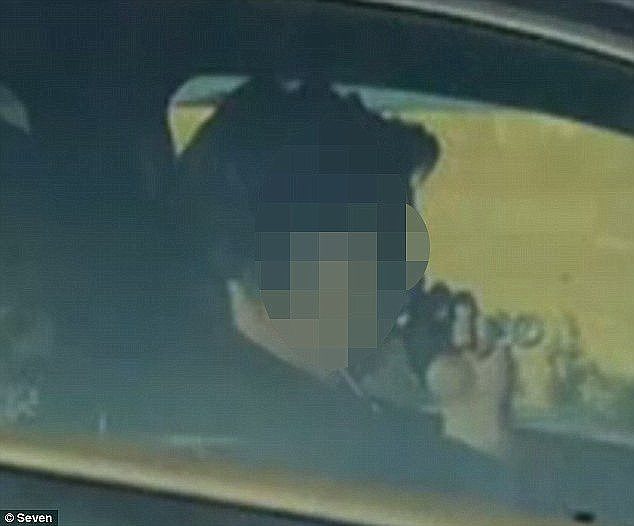 An astonishing photograph allegedly showing the woman inhaling from the glass pipe was taken on the Kwinana Freeway in Western Australia on August 13Â 