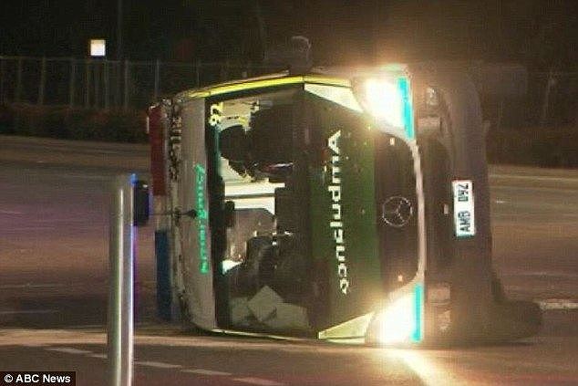 An ambulance transporting a patient to the Royal Adelaide Hospital rolled to its side following a collision with a Toyota Camry on Tuesday night