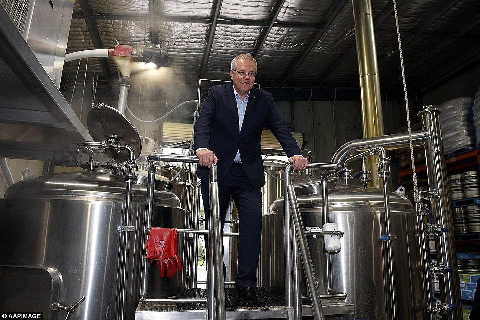 Australian Prime Minister Scott Morrison inspects brewing equipment during a visit to the Six Strings Brewery, in Erina, on the NSW Central Coast