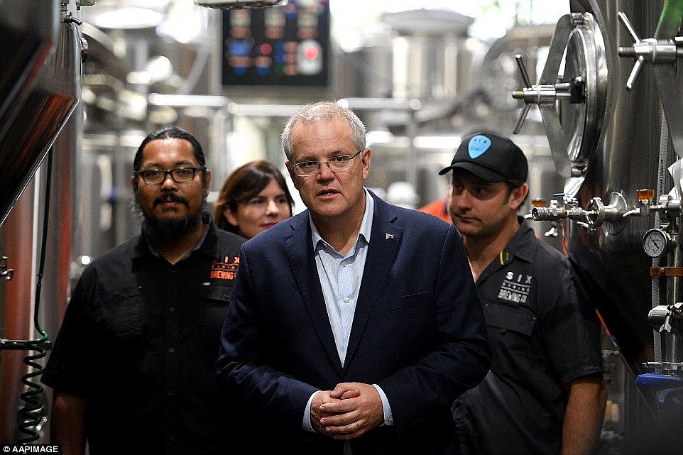 Australian Prime Minister Scott Morrison along with Federal MP for Robertson Lucy Wicks (second left) and co-owners Chris Benson (left) and Ryan Harris during the tour