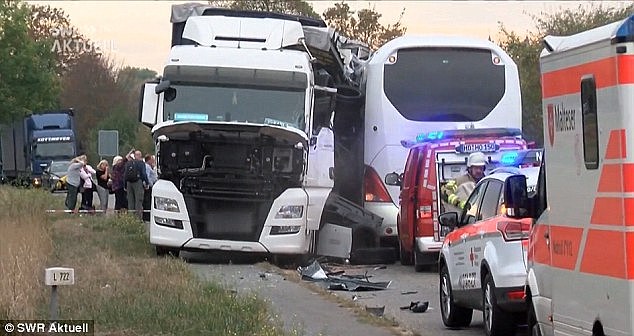 A bus carrying more than 30 tourists from Australia and North America has crashed into a truck in Germany - leaving nine people fighting for their lives
