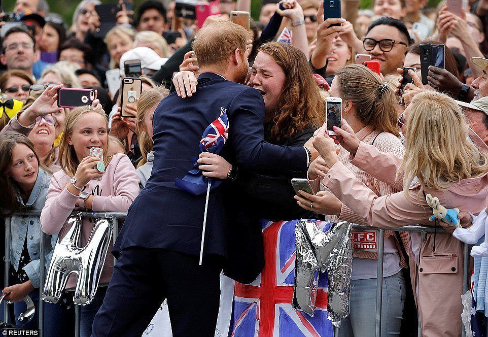 One fan let her emotions get the better of her, bursting into tears as Prince Harry offered up a hug