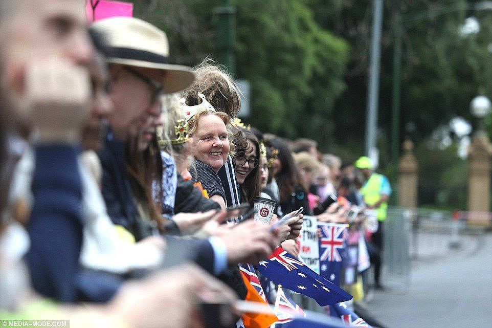 Royal fans are seen eagerly awaiting the arrival of theÂ The Duke and Duchess of Sussex in Melbourne on Thursday morning