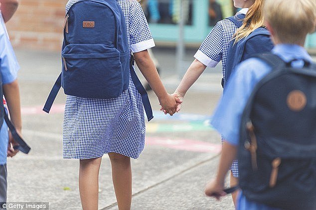 The traditional school uniform for girls will be replaced with pants for pupils in years one and two (stock image)