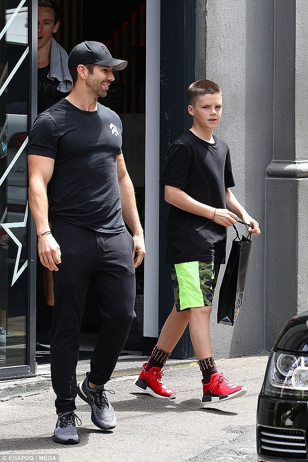 Healthy lad:Â Cruz, 13, looked ready for a workout in a baggy T-shirt and sporty sneakers