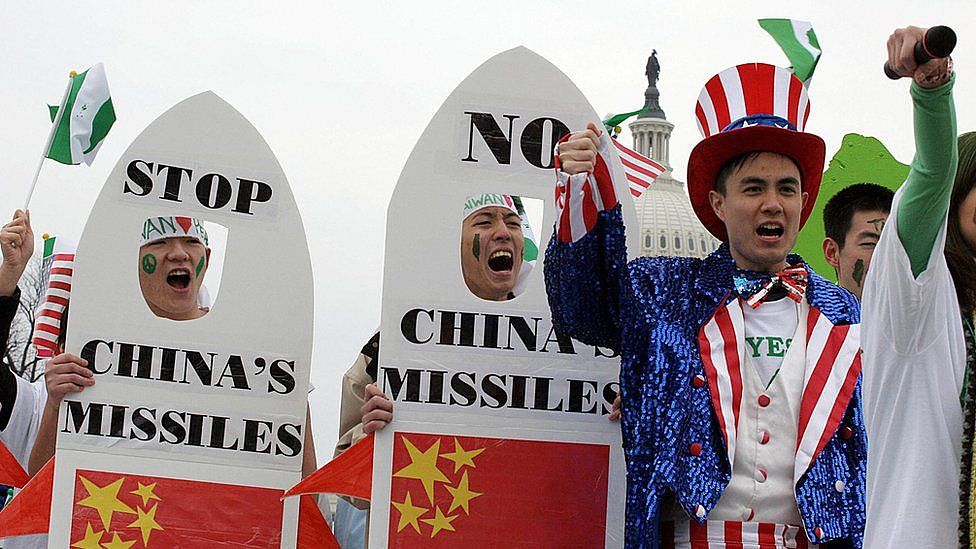 Taiwanese-Americans demonstrate 26 March, 2005, near the US Capitol (rear) in Washington, DC, to protest China's anti-secession law. The controversial anti-secession law, passed by the Chinese parliament last week, authorizes the use of military force against Taiwan if the island moves toward formal independence.