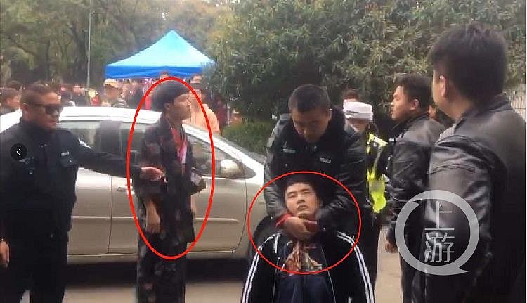 图为武汉大学事发现场，左图男子为被指身穿和服。视频截屏