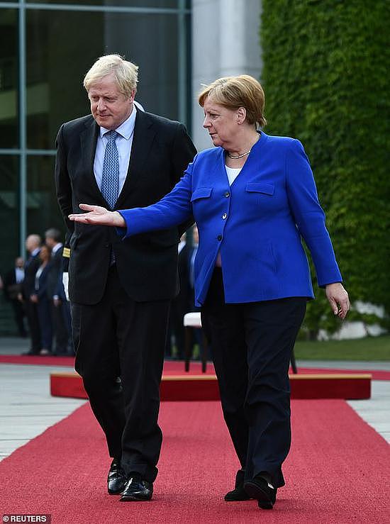 德国总理默克尔与英国首相约翰逊于21日会面。（图源：路透社）