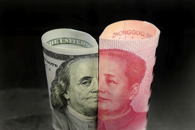 中美贸易摩擦升级，人民币可能继续贬值。 （路透资料图片）
