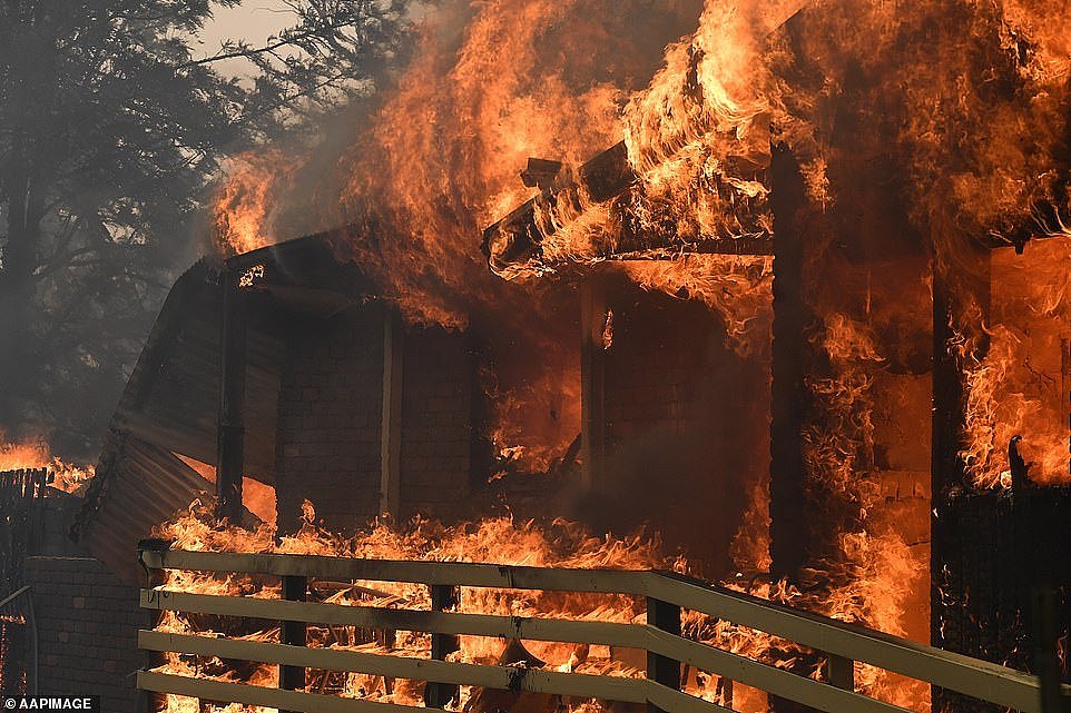 A home was covered in flames on Hassall Road in Buxton as the Green Wattle Creek Fire tore through the tiny town in the New South Wales Southern Highlands