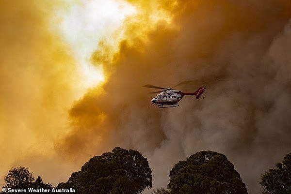 23006662-7853459-Fire_and_rescue_as_well_as_waterbombing_helicopters_did_their_be-a-9_1578222462212.jpg,0