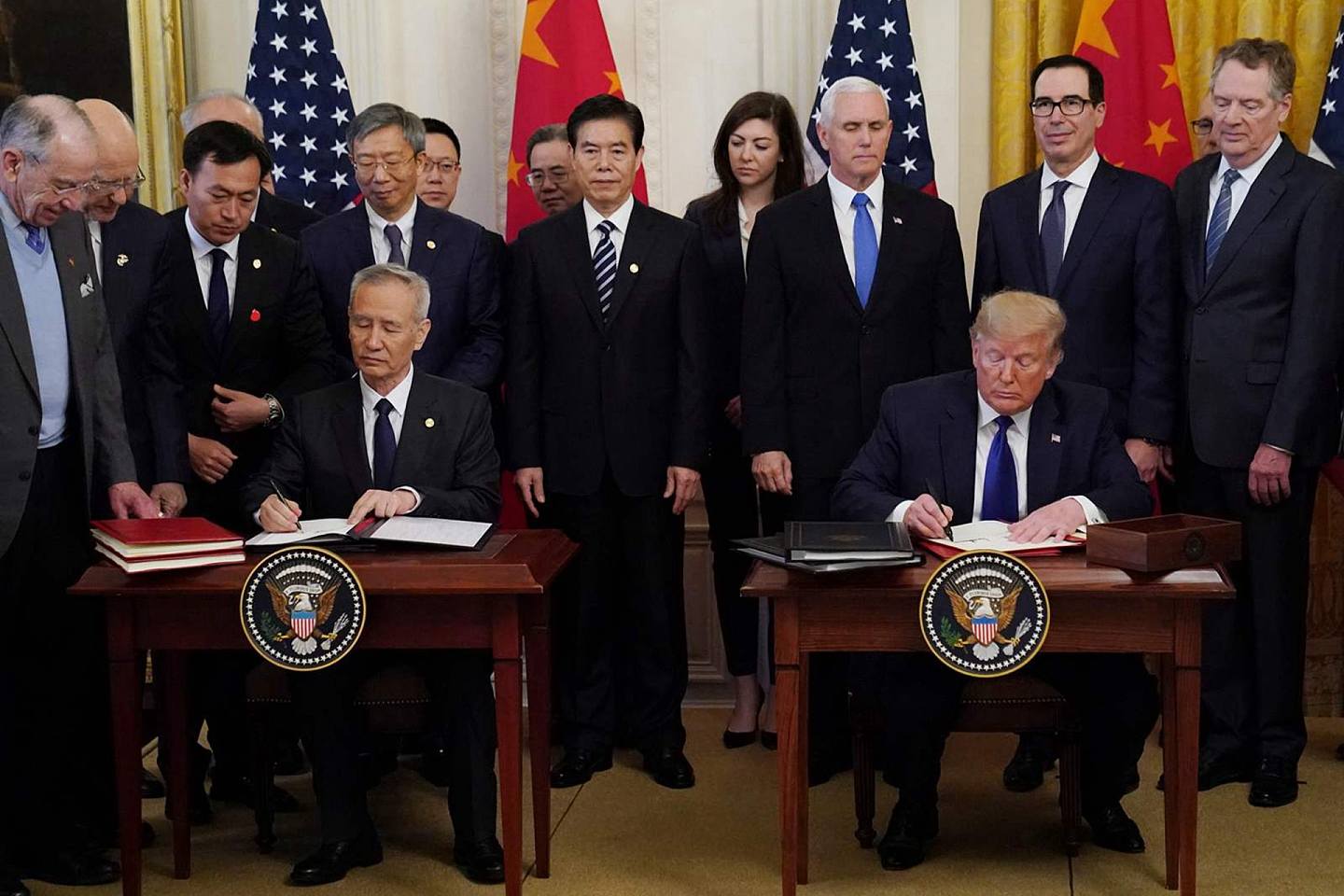 中美签订第一阶段贸易协议，被部分中国民众认为是“辱国”。（Reuters）