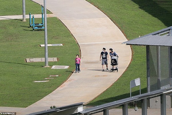 24329026-7968219-A_young_family_with_a_stroller_were_seen_walking_along_one_of_th-a-1_1580880237045.jpg,0